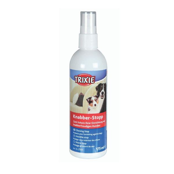 A bottle of Trixie Chew Stop Spray with a puppy in the background